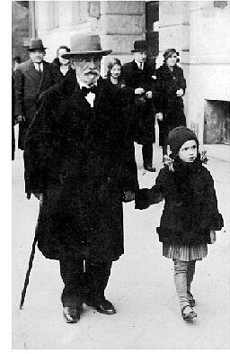 My grandfather and me walking in Kalisz. I am five or six years old. The coat I'm wearing was made to measure for me.